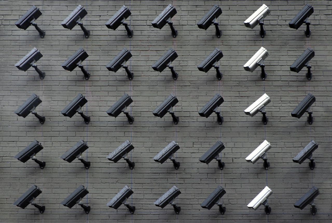 Wall of surveillance cameras pointing in different directions — monitoring is only one piece of insider risk management